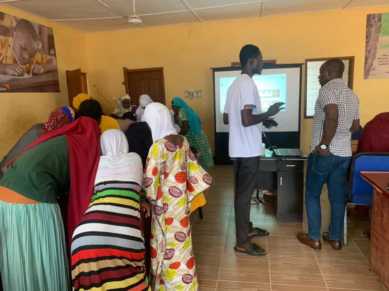 Community members participating in a digital skills session